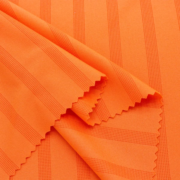 Polyester interlock jacquard fabric in orange color I540