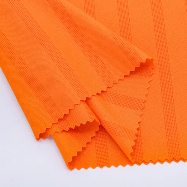 Polyester interlock jacquard fabric in orange color I540