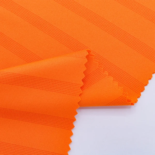 Polyester interlock jacquard fabric in orange color I540