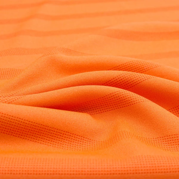 Polyester interlock jacquard fabric in orange color I540