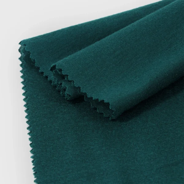 Polyester single jersey fabric in dark green color S586