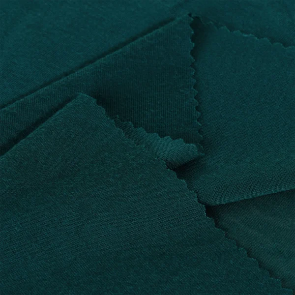 Polyester single jersey fabric in dark green color S586