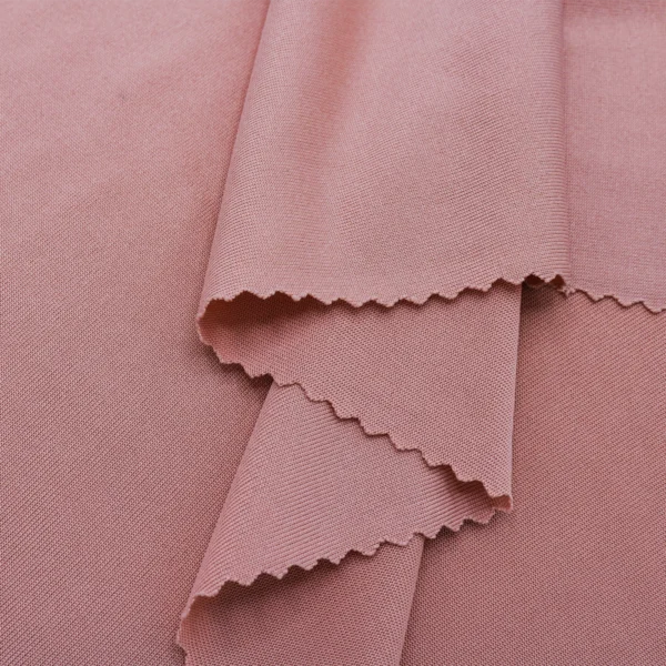 Polyester single jersey fabric in nude pink color S642