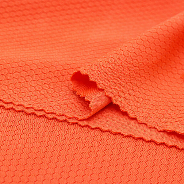 Polyester hexagon knit mesh fabric in orange QMD899