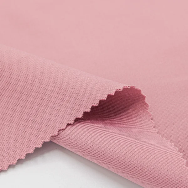 ผ้าโพลีเอสเตอร์ ผ้าวอร์มไมโครสแปนเด็กซ์ สีชมพูนู้ด GDD376