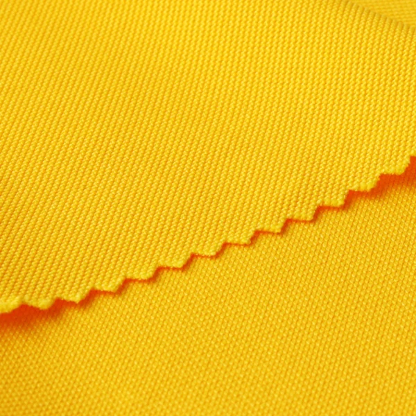 ผ้าโพลีเอสเตอร์ ผ้าจูติ ผ้าปิเก้ สีเหลือง P335