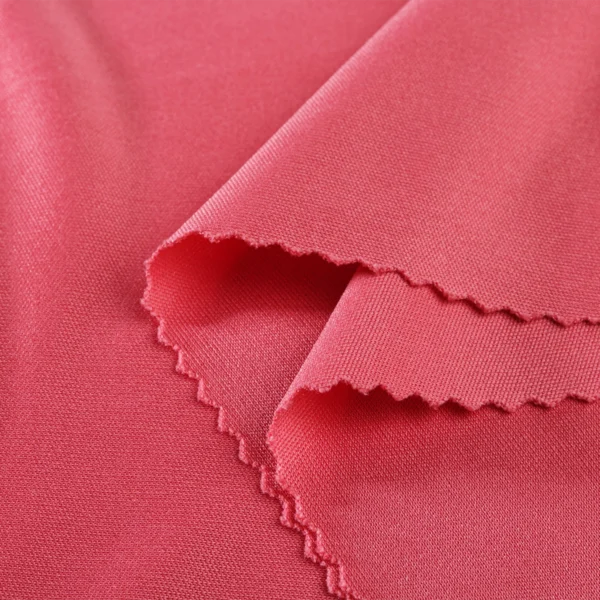ผ้าโพลีเอสเตอร์ ผ้าอินเตอร์ล็อค ผ้าเรียบ สีชมพู QI362