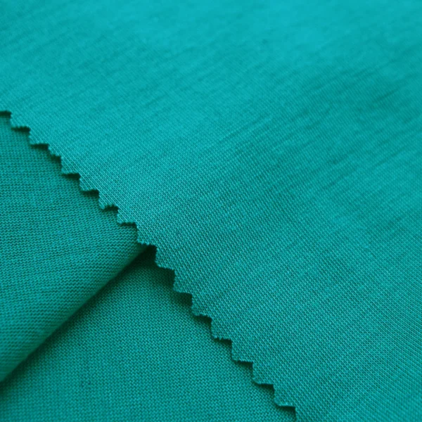ผ้าโพลีเอสเตอร์ ผ้าทีเค ผ้าซิงเกิลเจอร์ซีย์ สีเขียว S586-O9340