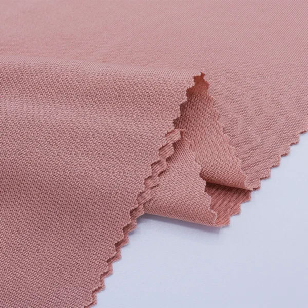 ผ้าโพลีเอสเตอร์ ผ้าทีเค ผ้าซิงเกิลเจอร์ซีย์ สีชมพูนู้ด S642