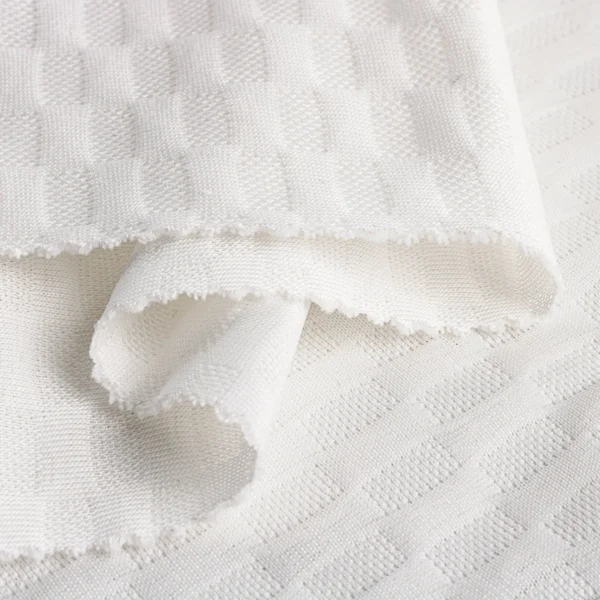 ผ้าโพลีเอสเตอร์ ผ้าอินเลย์ สีขาว ลายตารางนูน PL237-54